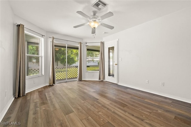 2218 NE 5th Ter, Cape Coral, FL 33909 - empty room with dark wood-style floors, baseboards, visible vents, and ceiling fan