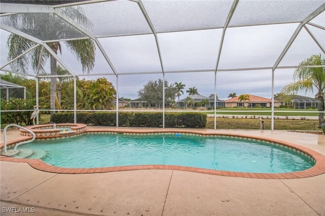 20854 Wheelock Dr, North Fort Myers, FL 33917 - view of pool with a patio area, glass enclosure, and a pool with connected hot tub