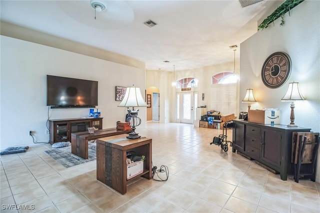 20854 Wheelock Dr, North Fort Myers, FL 33917 - living room featuring light tile patterned floors, visible vents, and arched walkways
