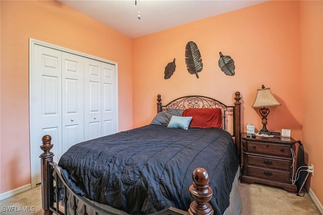 20854 Wheelock Dr, North Fort Myers, FL 33917 - bedroom with a closet, baseboards, and light colored carpet
