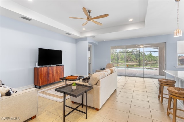 13104 Silver Thorn Loop, North Fort Myers, FL 33903 - living area featuring ceiling fan, light tile patterned flooring, a tray ceiling, and recessed lighting
