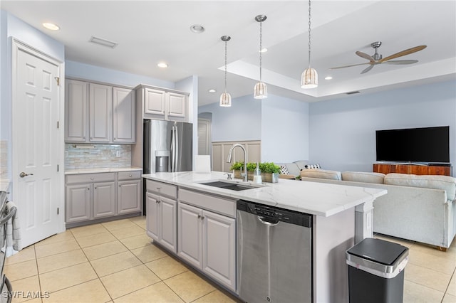 13104 Silver Thorn Loop, North Fort Myers, FL 33903 - kitchen featuring stainless steel appliances, a sink, gray cabinets, light tile patterned floors, and a ceiling fan
