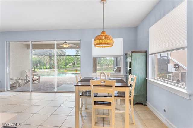 13104 Silver Thorn Loop, North Fort Myers, FL 33903 - dining space featuring light tile patterned flooring, ceiling fan, a sunroom, and baseboards