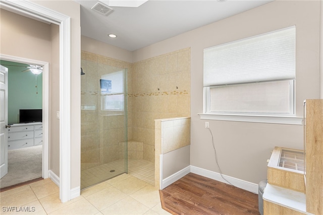 13104 Silver Thorn Loop, North Fort Myers, FL 33903 - bathroom with walk in shower, baseboards, recessed lighting, a ceiling fan, and tile patterned flooring