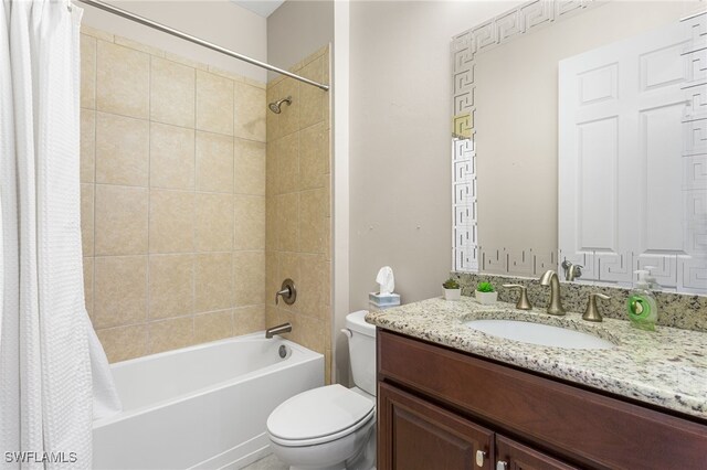 13104 Silver Thorn Loop, North Fort Myers, FL 33903 - full bath with toilet, vanity, and shower / bath combo with shower curtain