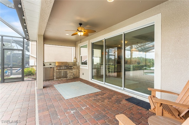 13104 Silver Thorn Loop, North Fort Myers, FL 33903 - view of patio with an outdoor kitchen, a ceiling fan, and glass enclosure