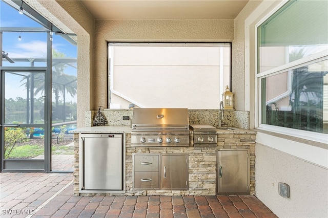 13104 Silver Thorn Loop, North Fort Myers, FL 33903 - view of patio with glass enclosure and a sink