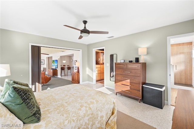 bedroom featuring visible vents, a ceiling fan, and baseboards