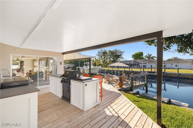 view of dock with a sink, a residential view, and boat lift