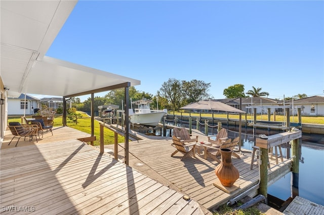 view of dock featuring a water view and boat lift