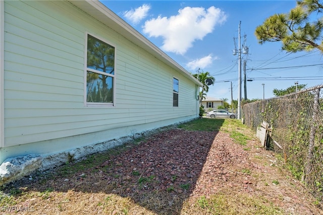 view of property exterior with fence