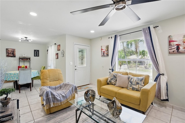 living area featuring light tile patterned floors, baseboards, recessed lighting, and a ceiling fan