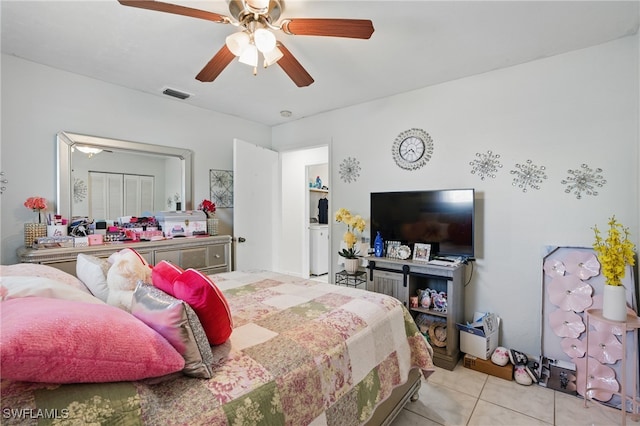 tiled bedroom with visible vents and ceiling fan