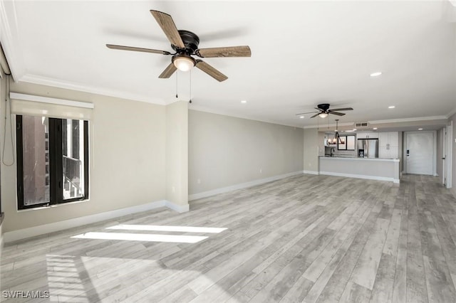 unfurnished living room with light wood finished floors, baseboards, a ceiling fan, and ornamental molding