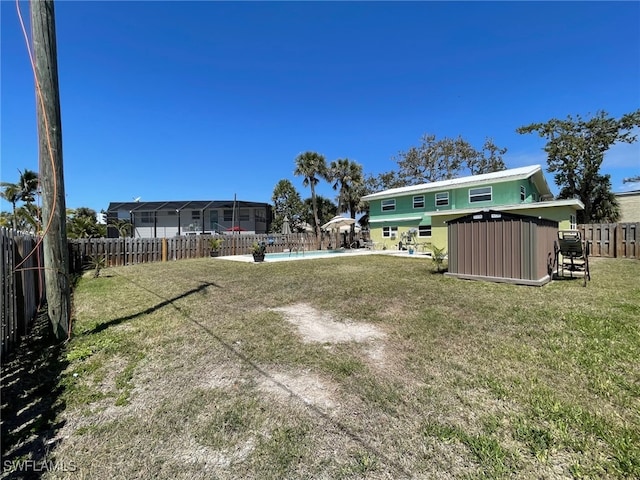 5460 Oak Ridge Ave, Fort Myers Beach, FL 33931 - view of yard with an outbuilding, a fenced in pool, a fenced backyard, and a shed