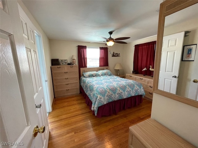 5460 Oak Ridge Ave, Fort Myers Beach, FL 33931 - bedroom with a ceiling fan and light wood finished floors