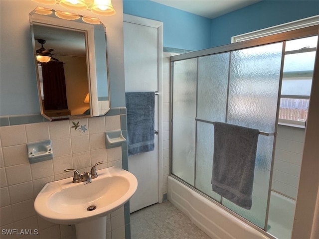5460 Oak Ridge Ave, Fort Myers Beach, FL 33931 - full bath featuring tile walls, bath / shower combo with glass door, ceiling fan, and a sink