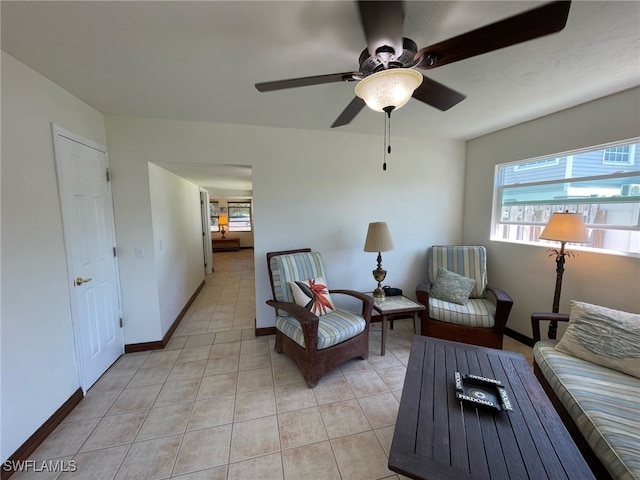 5460 Oak Ridge Ave, Fort Myers Beach, FL 33931 - living room with baseboards, ceiling fan, and light tile patterned floors
