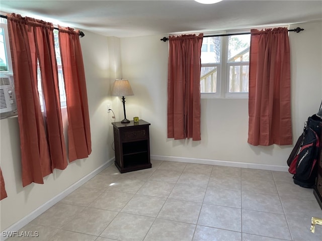 5460 Oak Ridge Ave, Fort Myers Beach, FL 33931 - spare room featuring baseboards and light tile patterned floors