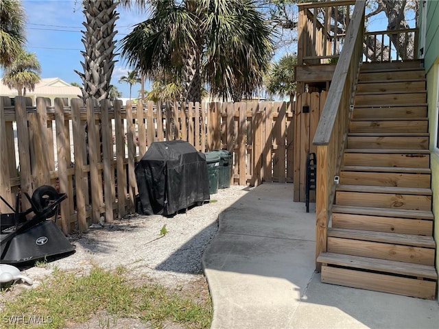 5460 Oak Ridge Ave, Fort Myers Beach, FL 33931 - exterior space featuring a patio area, fence, and stairway