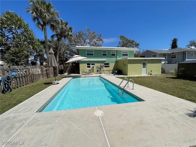 5460 Oak Ridge Ave, Fort Myers Beach, FL 33931 - view of swimming pool featuring a patio, a fenced in pool, a fenced backyard, and a yard