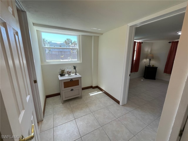 5460 Oak Ridge Ave, Fort Myers Beach, FL 33931 - hall with light tile patterned floors and baseboards