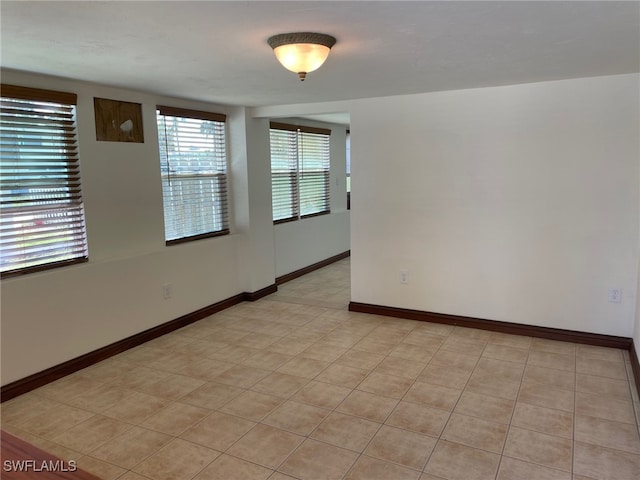 5460 Oak Ridge Ave, Fort Myers Beach, FL 33931 - spare room featuring baseboards