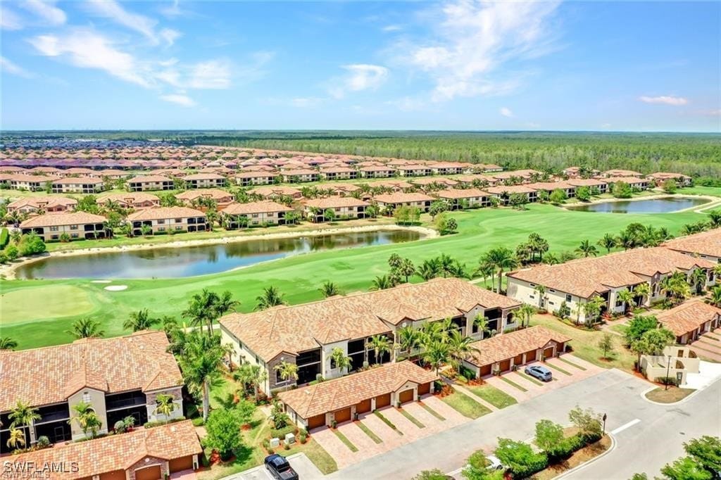 bird's eye view featuring a residential view, a water view, and view of golf course