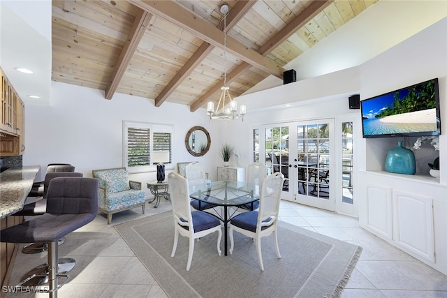 dining room featuring a chandelier, beamed ceiling, wood ceiling, light tile patterned floors, and french doors