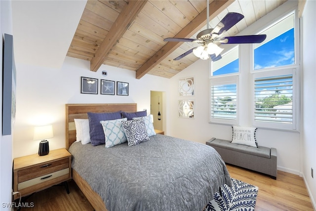 bedroom with baseboards, wood ceiling, wood finished floors, and vaulted ceiling with beams