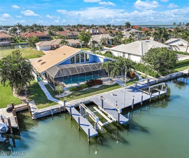 bird's eye view with a water view and a residential view