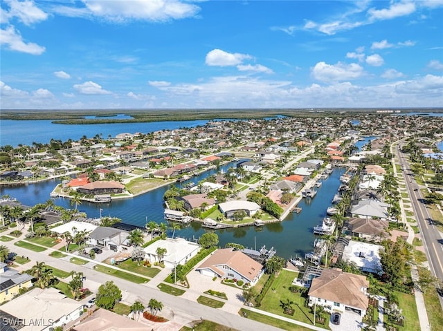 aerial view with a residential view and a water view