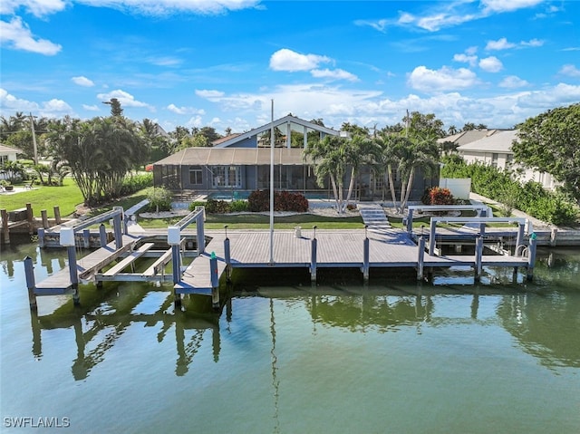 dock area with a water view, a lawn, a pool, boat lift, and a lanai