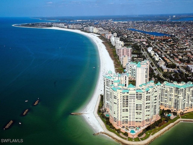 aerial view with a city view, a beach view, and a water view