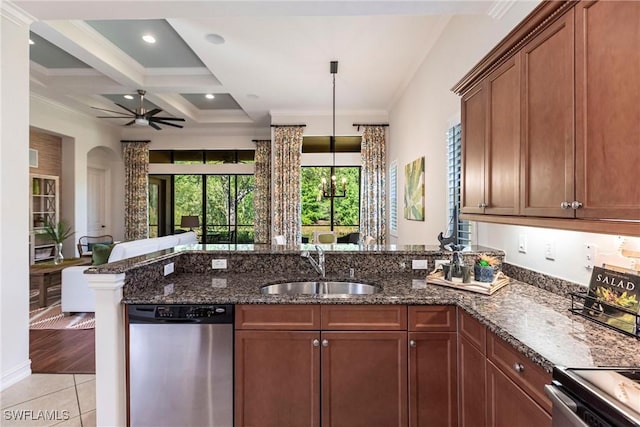 kitchen with dark stone countertops, a peninsula, coffered ceiling, stainless steel appliances, and a sink