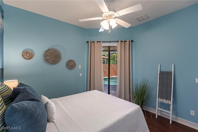 bedroom with a ceiling fan, wood finished floors, visible vents, baseboards, and access to outside