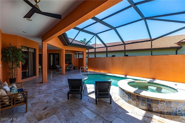 view of swimming pool with a lanai, a patio area, a pool with connected hot tub, and ceiling fan