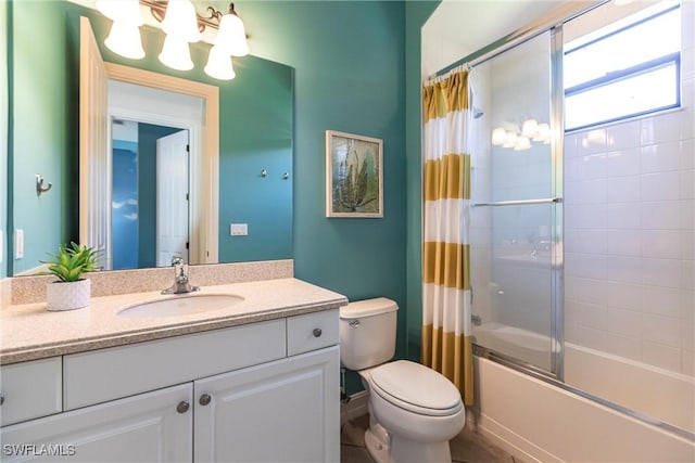 full bath with a chandelier, toilet, vanity, and shower / tub combo with curtain