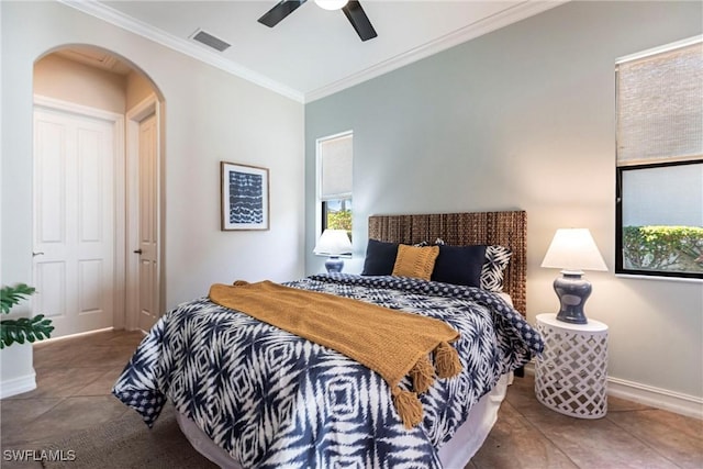 8295 Provencia Ct, Fort Myers, FL 33912 - bedroom with arched walkways, ornamental molding, baseboards, tile patterned flooring, and ceiling fan