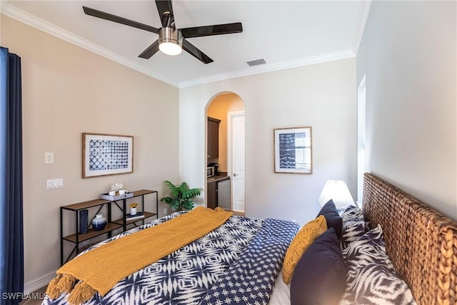 bedroom featuring visible vents, ornamental molding, ensuite bathroom, arched walkways, and ceiling fan