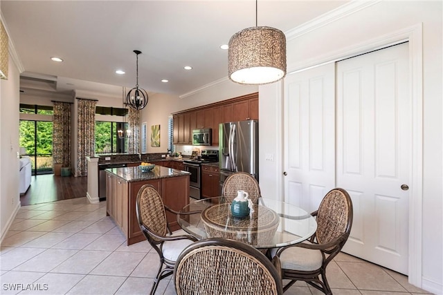 dining room featuring light tile patterned floors, recessed lighting, crown molding, and baseboards