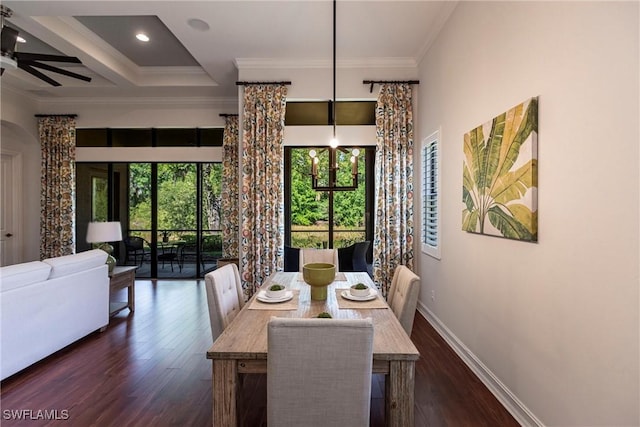 dining area with a wealth of natural light, baseboards, ornamental molding, and dark wood finished floors