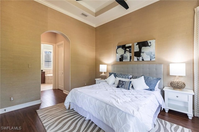 bedroom with arched walkways, visible vents, ornamental molding, and wood finished floors