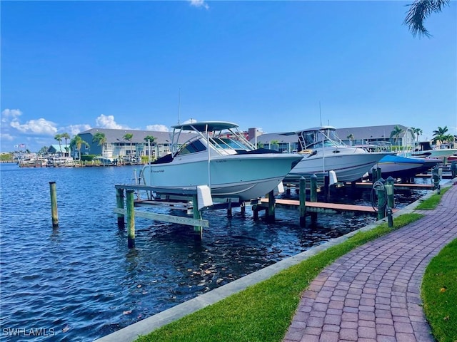 4703 SE 17th Pl Unit 105, Cape Coral, FL 33904 - dock area with boat lift, a water view, and a residential view