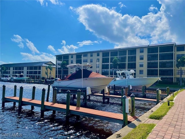 4703 SE 17th Pl Unit 105, Cape Coral, FL 33904 - dock with boat lift and a water view