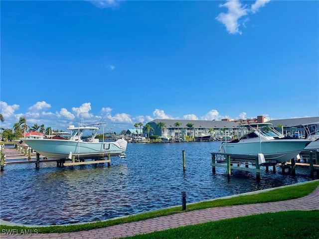 4703 SE 17th Pl Unit 105, Cape Coral, FL 33904 - dock area featuring boat lift and a water view