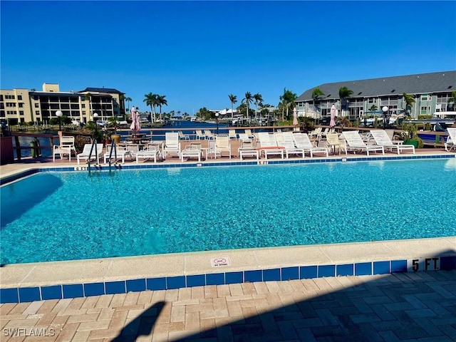 4703 SE 17th Pl Unit 105, Cape Coral, FL 33904 - community pool with a patio area