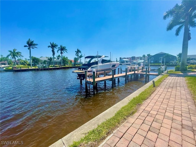 4703 SE 17th Pl Unit 105, Cape Coral, FL 33904 - dock featuring boat lift and a water view