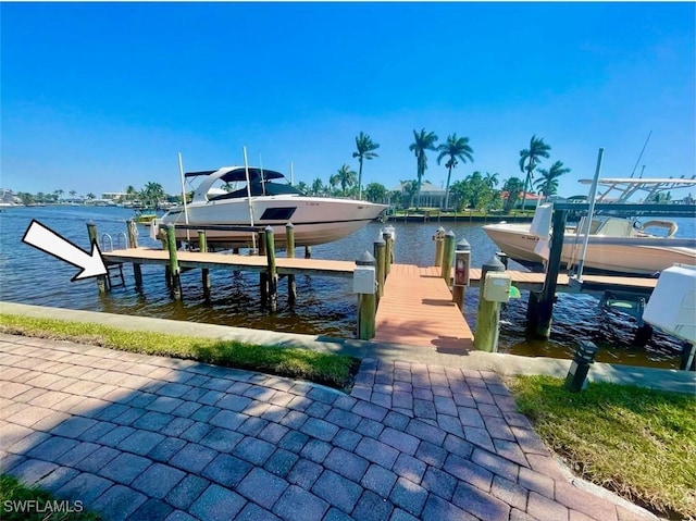 4703 SE 17th Pl Unit 105, Cape Coral, FL 33904 - dock area with boat lift and a water view