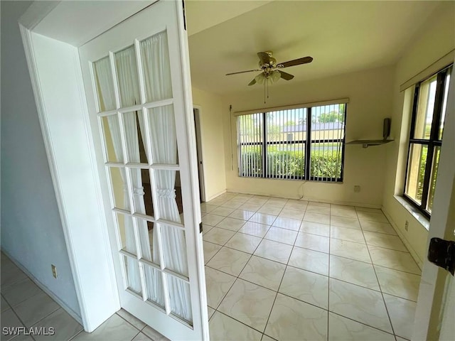 4703 SE 17th Pl Unit 105, Cape Coral, FL 33904 - unfurnished room with a ceiling fan and tile patterned flooring